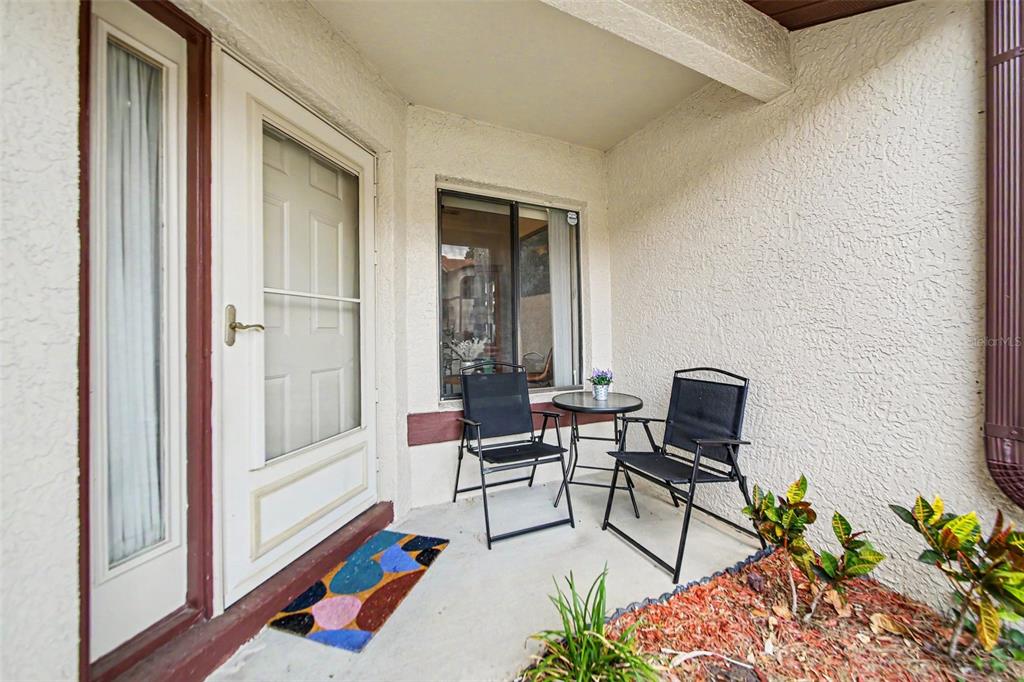 A two-story townhouse with a two-car garage, stucco exterior, and a red tile roof — 3336 GRAY FOX COVE UNIT 3336, APOPKA, FL