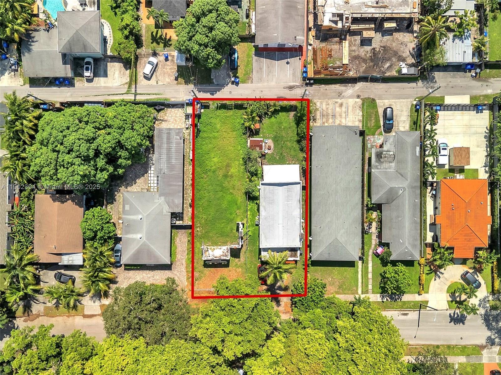 An aerial view shows a rectangular lot with a small house and a large yard — 1928 Dewey St, Hollywood FL 33020, HOLLYWOOD, FL