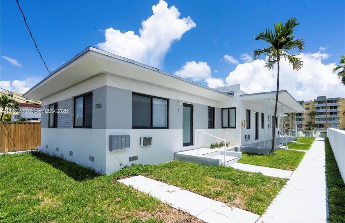 A single-story white and gray building with a palm tree and a concrete walkway — 7935 Crespi Blvd # 3, Miami Beach FL 33141, MIAMI BEACH, FL