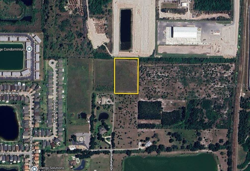 An aerial map view shows a rectangular vacant lot highlighted in yellow — 3000 ROWLAND DRIVE UNIT Tract C, PUNTA GORDA, FL