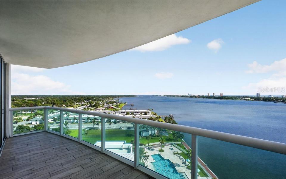A high-rise balcony with a glass railing overlooks a swimming pool and a large river — 241 RIVERSIDE DRIVE UNIT 1204, HOLLY HILL, FL