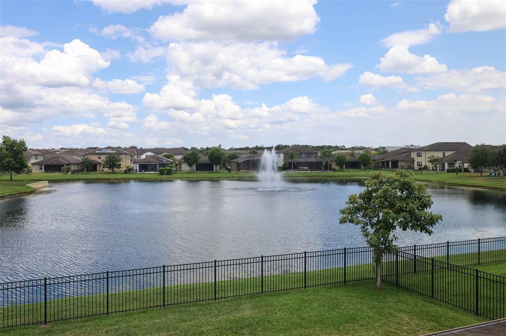 A kitchen features wood cabinets, granite countertops, stainless steel appliances, and a central island — 2610 MEAD AVENUE, ST CLOUD, FL