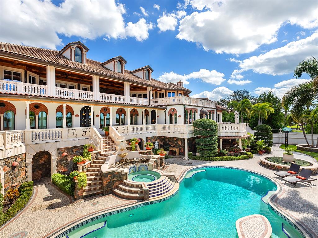 A large Mediterranean-style mansion with a multi-level terrace, stone exterior, and a swimming pool — 1310 S LAKE SHORE DRIVE, SARASOTA, FL