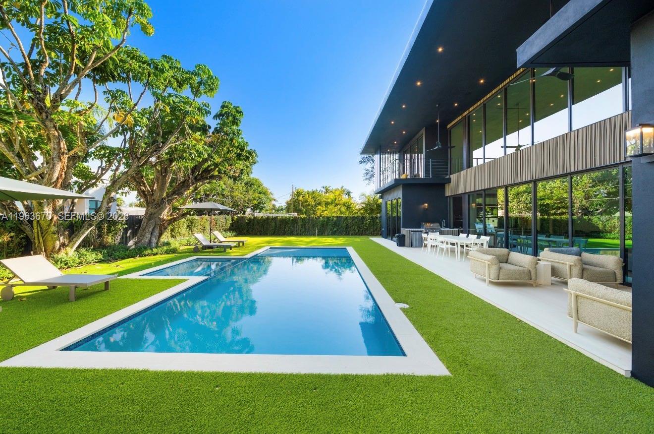 A modern two-story house with a swimming pool and artificial turf lawn — 19701 NE 21st Ct, Miami FL 33179, MIAMI, FL
