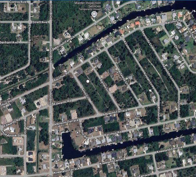 This is an aerial map view of a residential neighborhood with streets and a canal — 4190 AMIS LANE, PORT CHARLOTTE, FL
