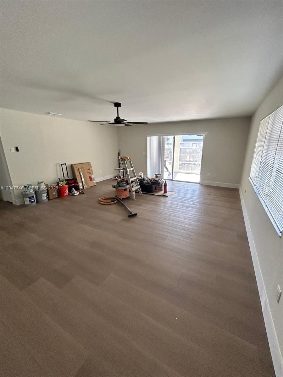 A single-story house features a gravel front yard, a screened porch, and a carport — 114 S Lakeside Dr # 114, Lake Worth FL 33460, LAKE WORTH, FL