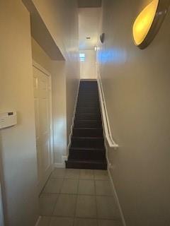 A narrow entryway features a tiled floor, a white door, and a staircase with dark treads — 2337 Vintage Drive, Lighthouse Point FL 33064, LIGHTHOUSE POINT, FL