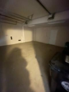 An empty, unfinished concrete storage room with exposed ceiling pipes and white walls — 2337 Vintage Drive, Lighthouse Point FL 33064, LIGHTHOUSE POINT, FL
