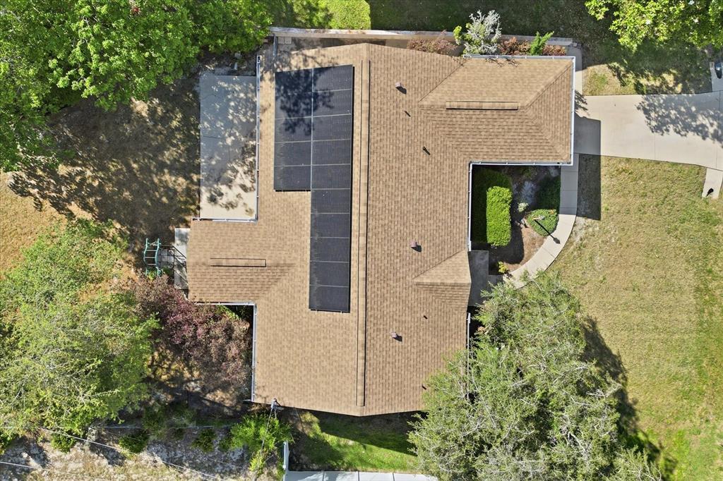 An aerial view shows a house with a brown shingled roof and solar panels — 966 W STARJASMINE PLACE, BEVERLY HILLS, FL