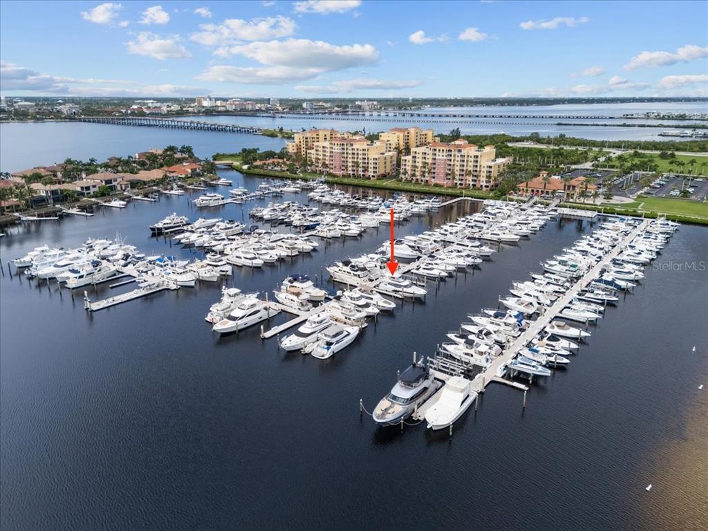 An aerial view shows a large marina filled with numerous yachts and boats — 102 RIVIERA DUNES WAY UNIT C-22, PALMETTO, FL