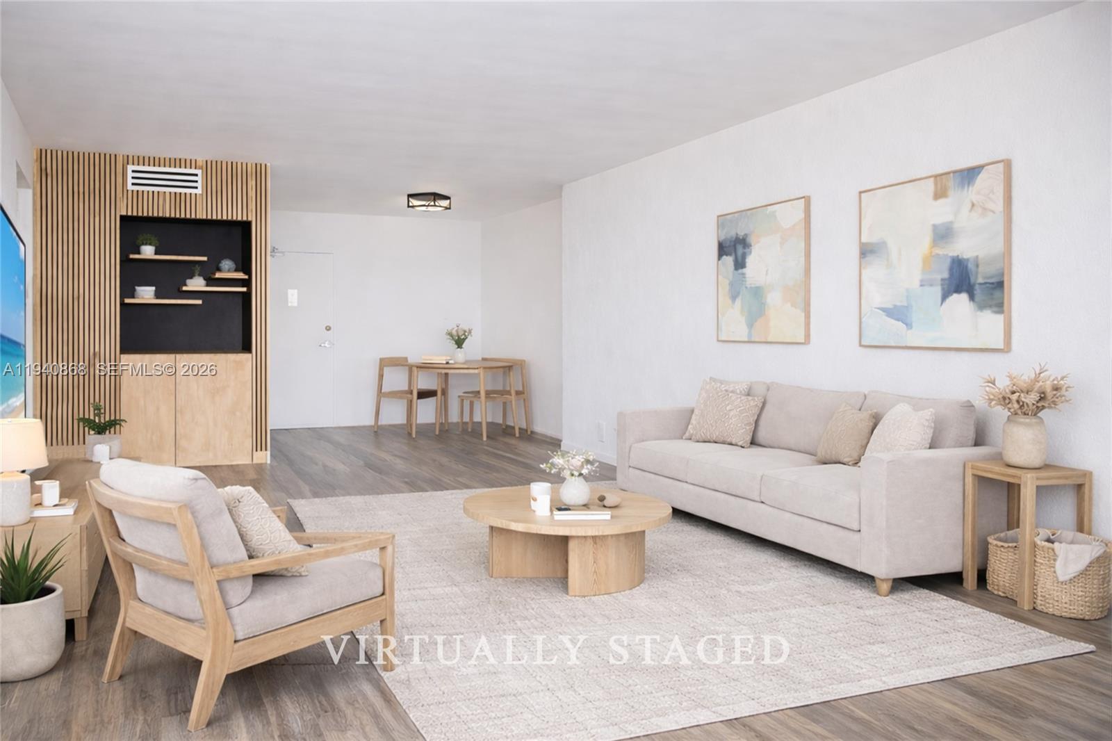 This is a virtually staged living room with light wood furniture and a slatted accent wall — 1200 West Ave # 708, Miami Beach FL 33139, MIAMI BEACH, FL