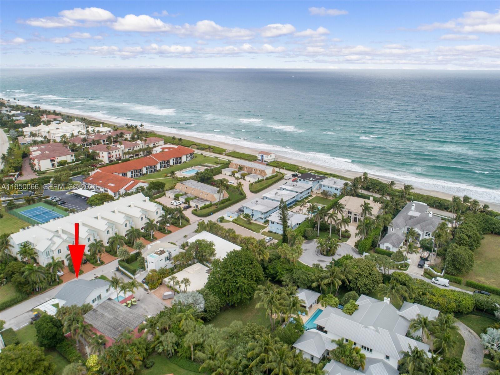 An aerial view shows a coastal neighborhood with houses, a tennis court, and the ocean — 12 Adams Road, Ocean Ridge FL 33435, OCEAN RIDGE, FL