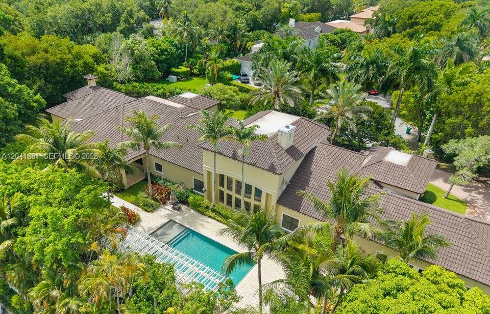 An aerial view of a large house with a tile roof and a swimming pool — 9001 SW 59th Ct, Pinecrest FL 33156, PINECREST, FL