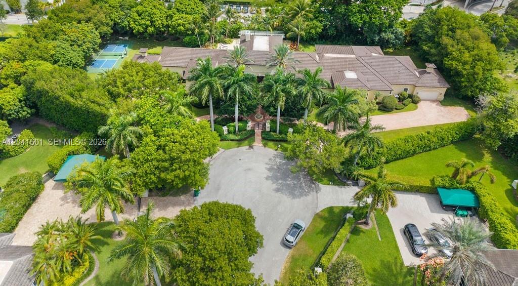 An aerial view shows a large house with a circular driveway and tennis court — 9001 SW 59th Ct, Pinecrest FL 33156, PINECREST, FL