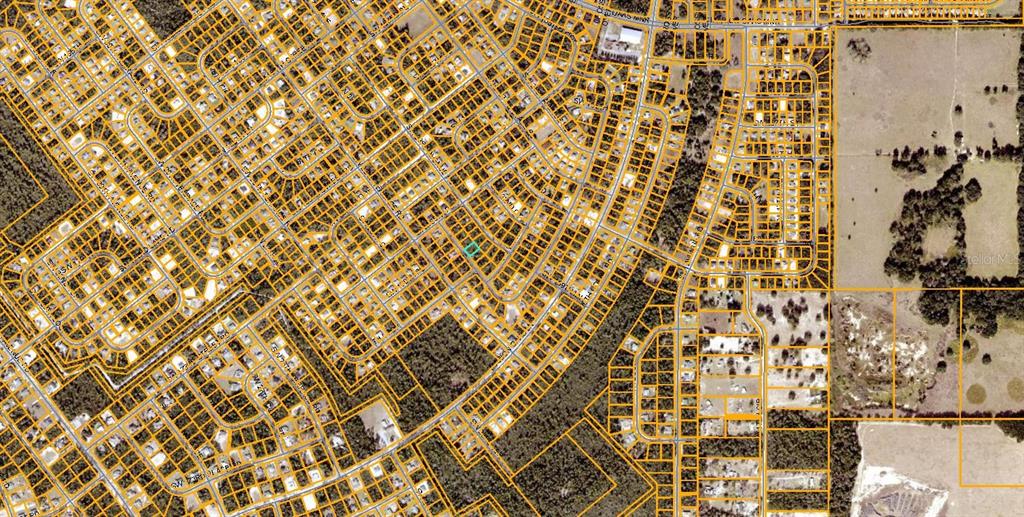 This is an aerial map showing property parcel boundaries over a residential neighborhood and land — SW 21ST CIRCLE, OCALA, FL