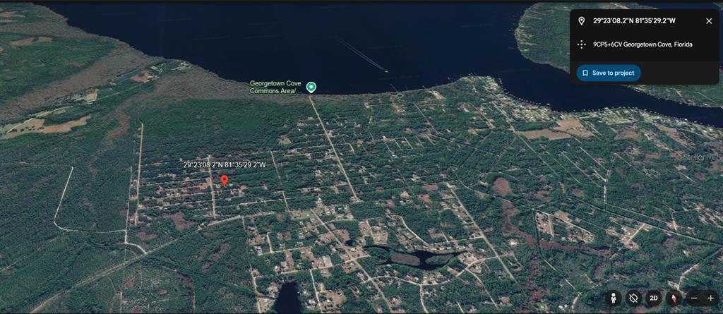 An aerial map view shows a residential neighborhood with wooded lots near a large lake — 433 GARDENIA AVENUE, GEORGETOWN, FL