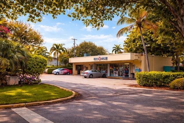 A single-story commercial food store building with a parking lot and surrounding palm trees — 2131 NE 48th Street, Lighthouse Point FL 33064, LIGHTHOUSE POINT, FL
