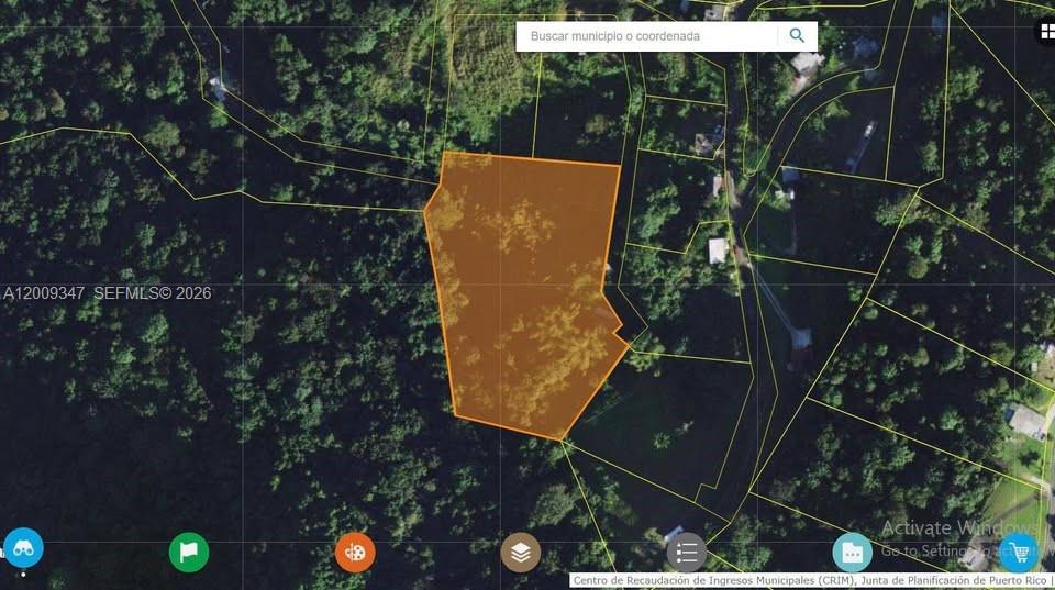 This is a satellite map view showing a highlighted land parcel in a wooded area — Bo. Campo Rico Carr 9957 Solar C KM3.2, PR, PR