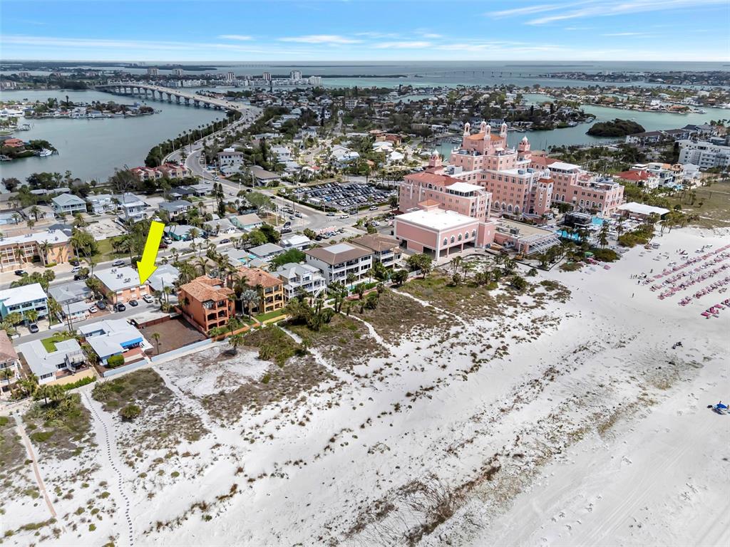 An aerial view shows a beachside residential building marked with a yellow arrow — 3514 GULF BOULEVARD UNIT 3, ST PETE BEACH, FL