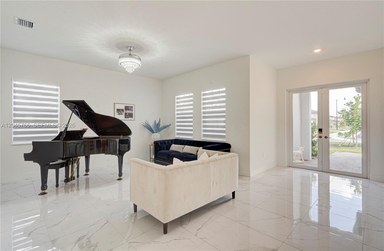 A living room features a grand piano, two sofas, and white marble-style tile flooring — 4367 SW 123 ln, Davie FL 33330, DAVIE, FL
