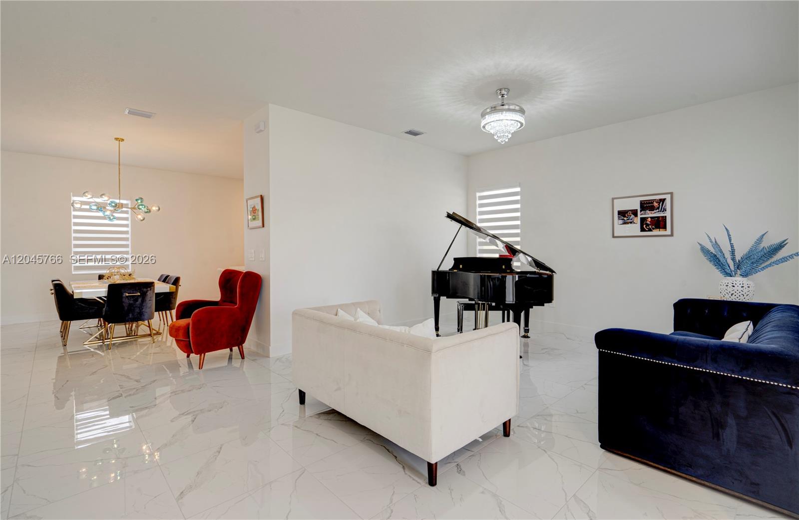 A living room with a grand piano, white marble floors, and a dining area nearby — 4367 SW 123 ln, Davie FL 33330, DAVIE, FL