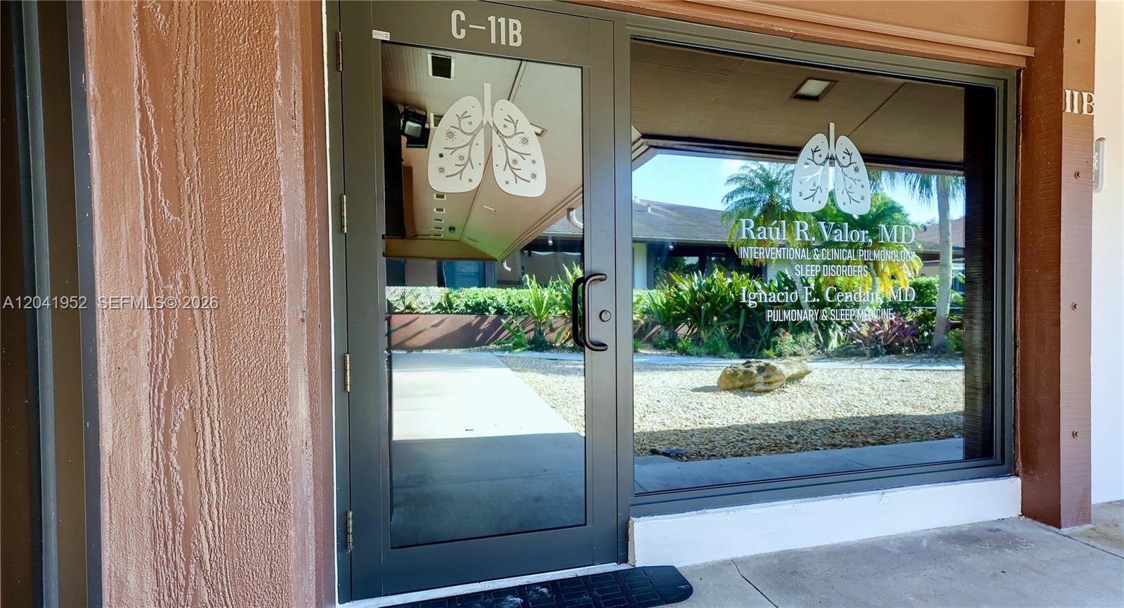 The exterior entrance to a medical office features a glass door and window with signage — 8525 SW 92nd St # 11B, Miami FL 33156, MIAMI, FL