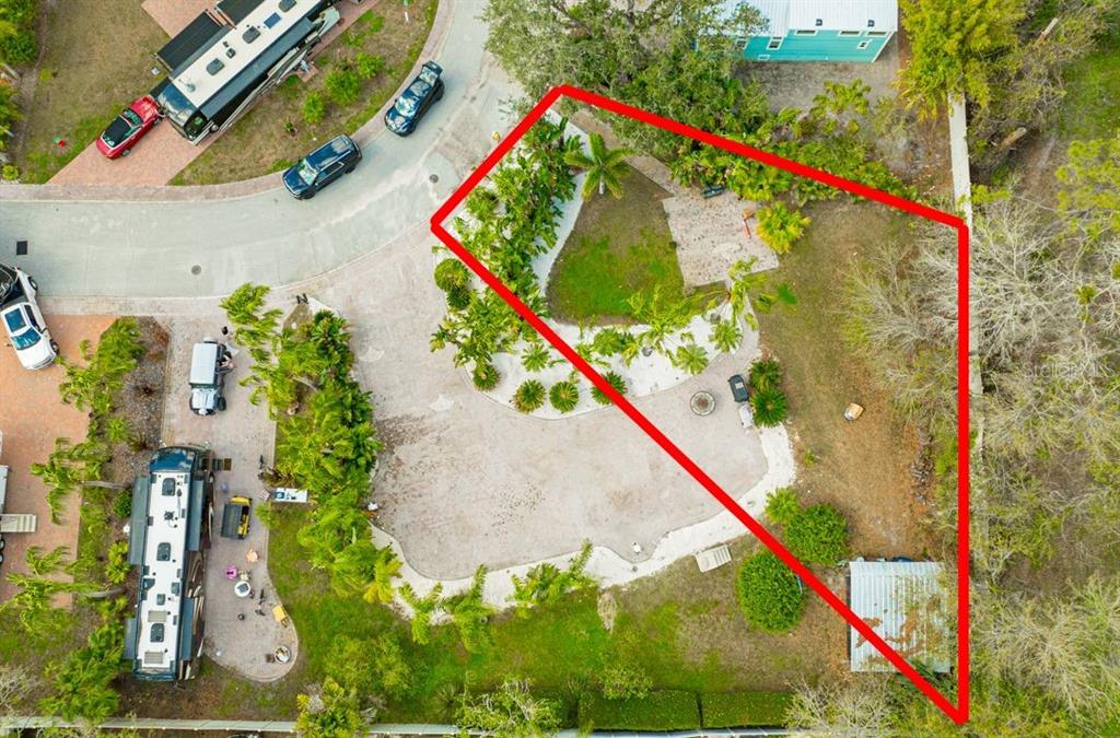 An aerial view shows a landscaped lot with a paved driveway and a small shed — 6857 AMANDA VISTA CIRCLE, LAND O LAKES, FL
