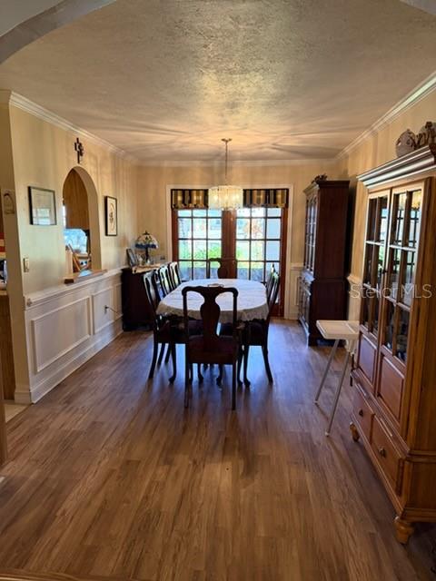 A dining room features wood-look flooring, a table with six chairs, and a wooden hutch — 30 PLACID OAKS DRIVE, LAKE PLACID, FL