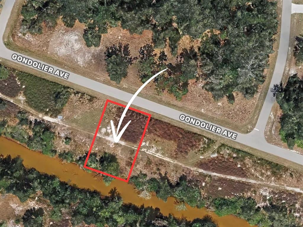 An aerial map view shows a vacant rectangular lot bordered by a road and canal — 29209 GONDOLIER AVENUE, PUNTA GORDA, FL