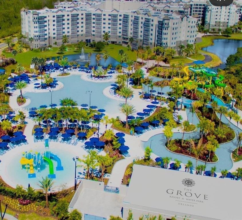 An aerial view of The Grove Resort and Water Park featuring pools and water slides — 14501 GROVE RESORT AVENUE UNIT 3425, WINTER GARDEN, FL