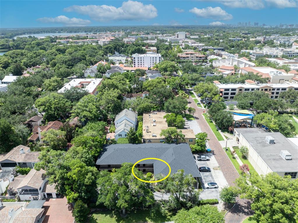 An aerial view shows a multi-story building with a yellow circle highlighting a balcony — 644 N KNOWLES AVENUE UNIT 3, WINTER PARK, FL