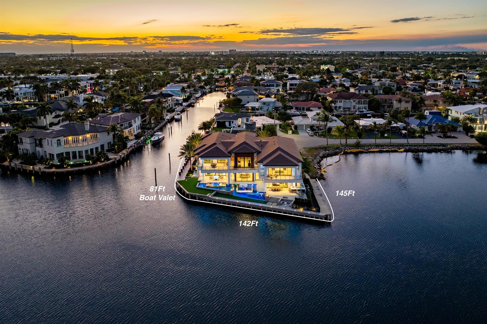 An aerial view shows a luxury waterfront home on a point with a private pool — 2934 NE 8th Avenue, Boca Raton FL 33431, BOCA RATON, FL