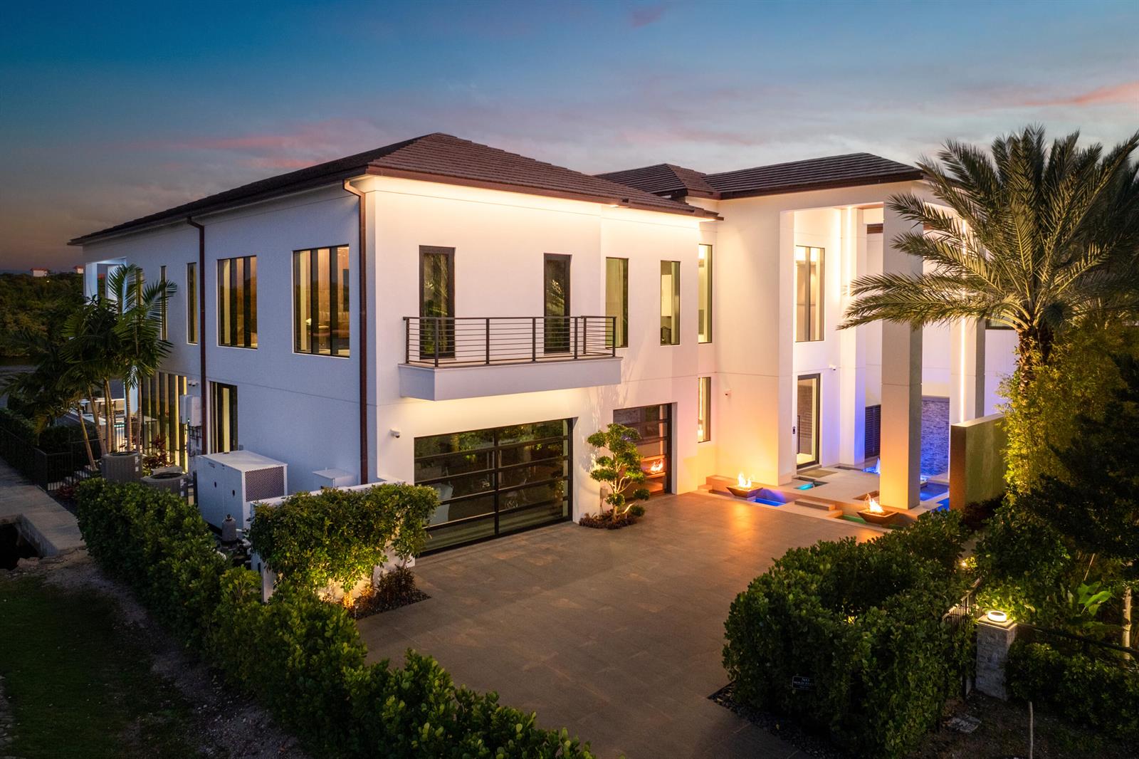 An aerial view of a modern two-story white house with a paved driveway and landscaping — 2934 NE 8th Avenue, Boca Raton FL 33431, BOCA RATON, FL