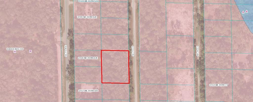 This is a property map showing a highlighted rectangular lot bordered by roads — TBD NE 110 COURT, FORT MC COY, FL