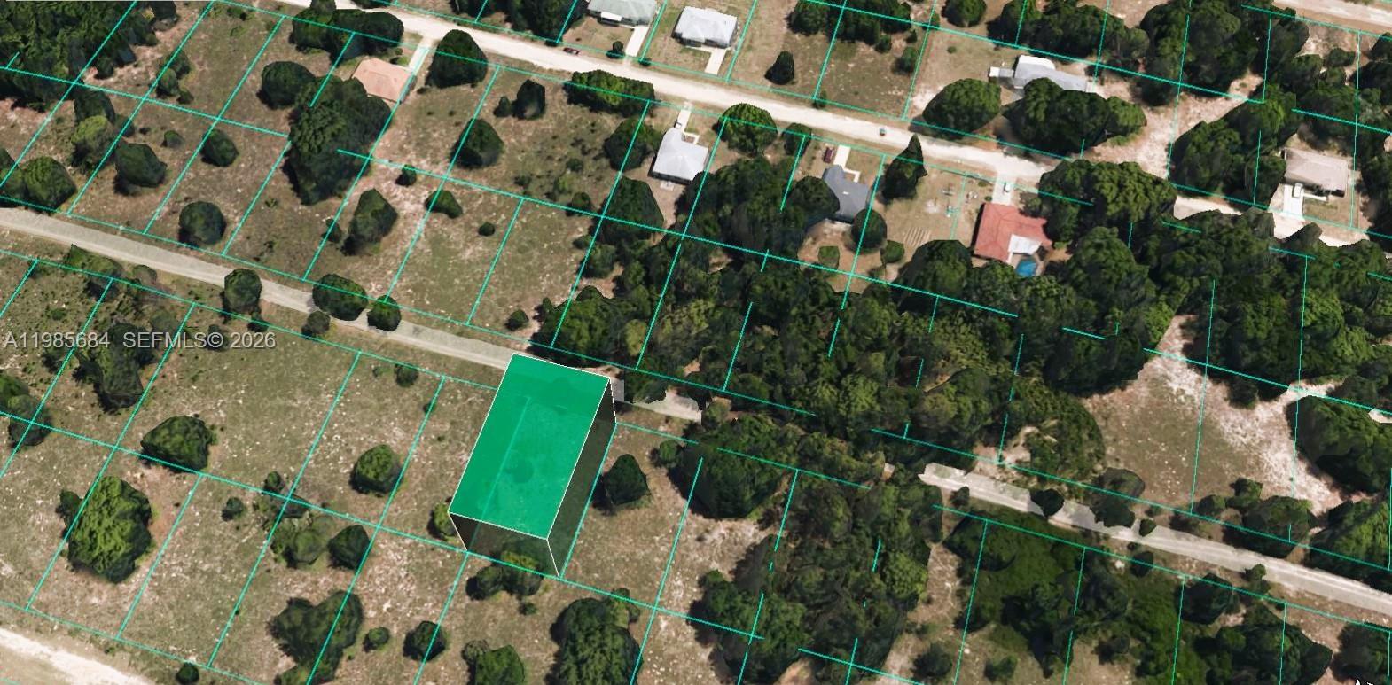 This aerial view shows a highlighted rectangular land parcel surrounded by trees and nearby houses — 2314 Garfield St, Inverness FL 34453, INVERNESS, FL