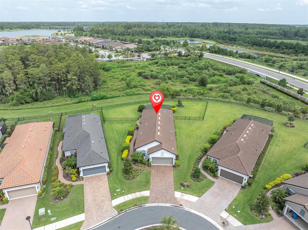 An aerial view shows a suburban house with a red location pin on its roof — 3142 FRANCOA DRIVE, ODESSA, FL