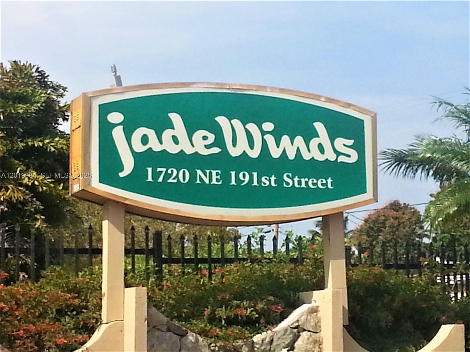 A green and white sign for Jade Winds stands on two posts outdoors — 1770 NE 191st St # 1, Miami FL 33179, MIAMI, FL