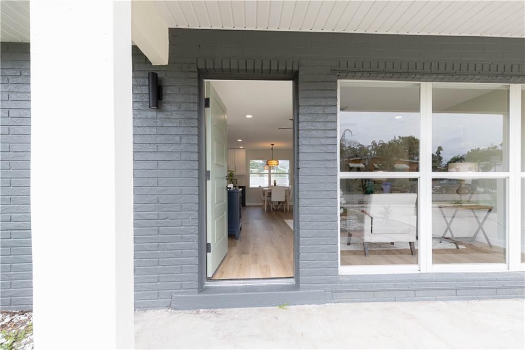 A view from a porch through an open door into a home's interior — SEBASTIAN, FL