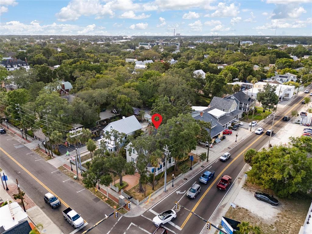 An aerial view shows a house with a red location pin in a residential area — 4 W ORANGE STREET, TARPON SPRINGS, FL