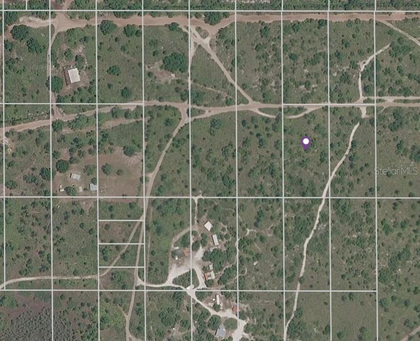 An aerial map view shows a rural plot of land with dirt roads and vegetation — HOLOPAW GROVES ROAD LOT 22, ST CLOUD, FL