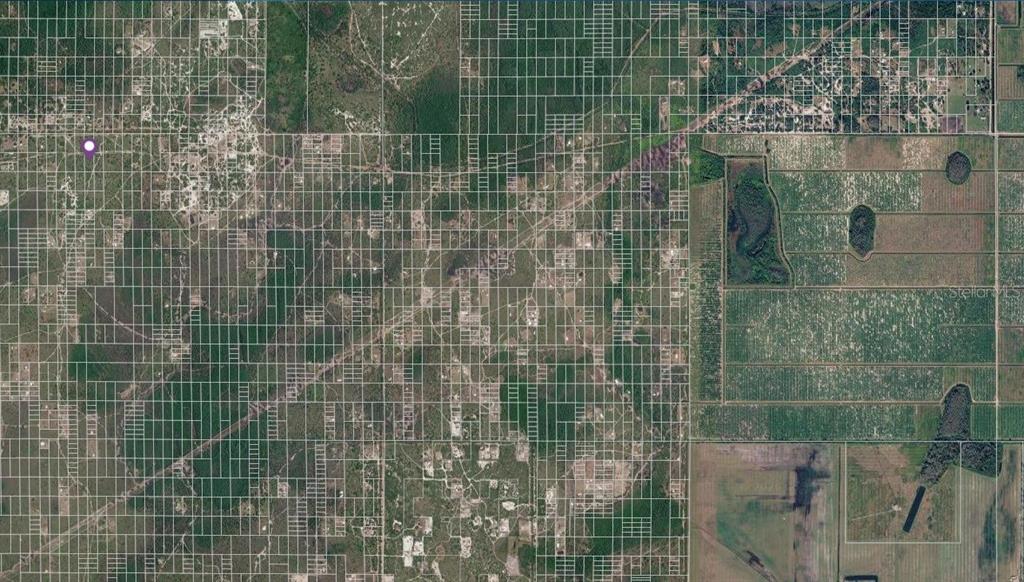 An aerial map view shows a large, gridded land parcel with scattered residential and agricultural areas — HOLOPAW GROVES ROAD LOT 22, ST CLOUD, FL