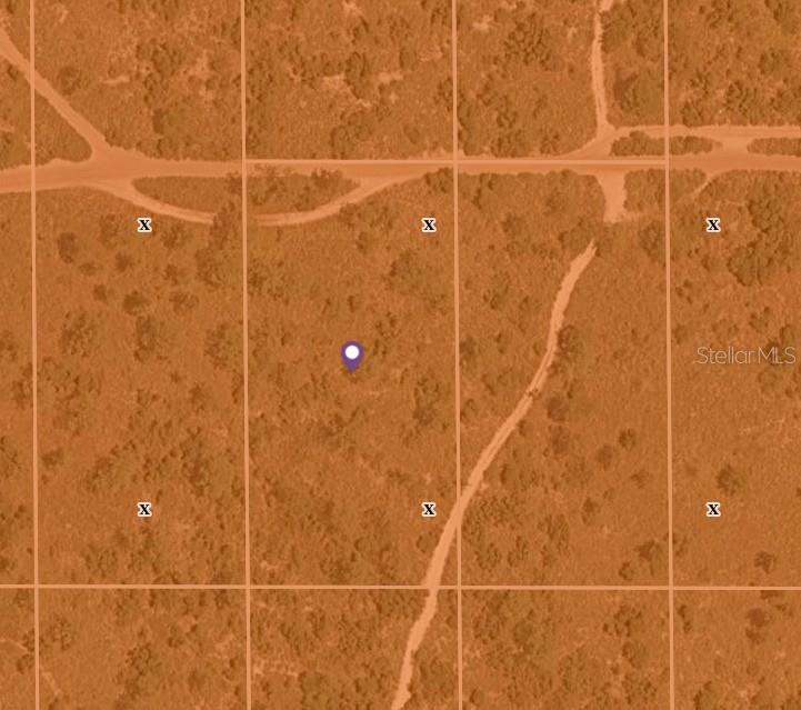 This is an aerial map view showing a plot of land marked with an X — HOLOPAW GROVES ROAD LOT 22, ST CLOUD, FL