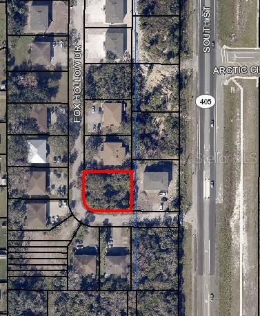 This is an aerial map showing a vacant lot outlined in red on Fox Hollow Drive — 2391 FOX HOLLOW DRIVE, TITUSVILLE, FL