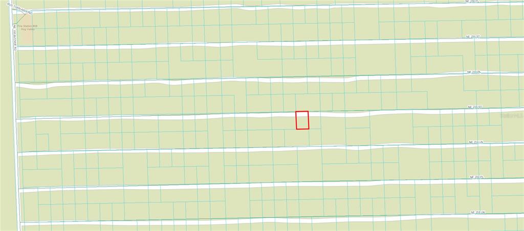 This is a map showing a highlighted rectangular property lot within a grid of streets — TBD NE 235TH STREET, FORT MC COY, FL