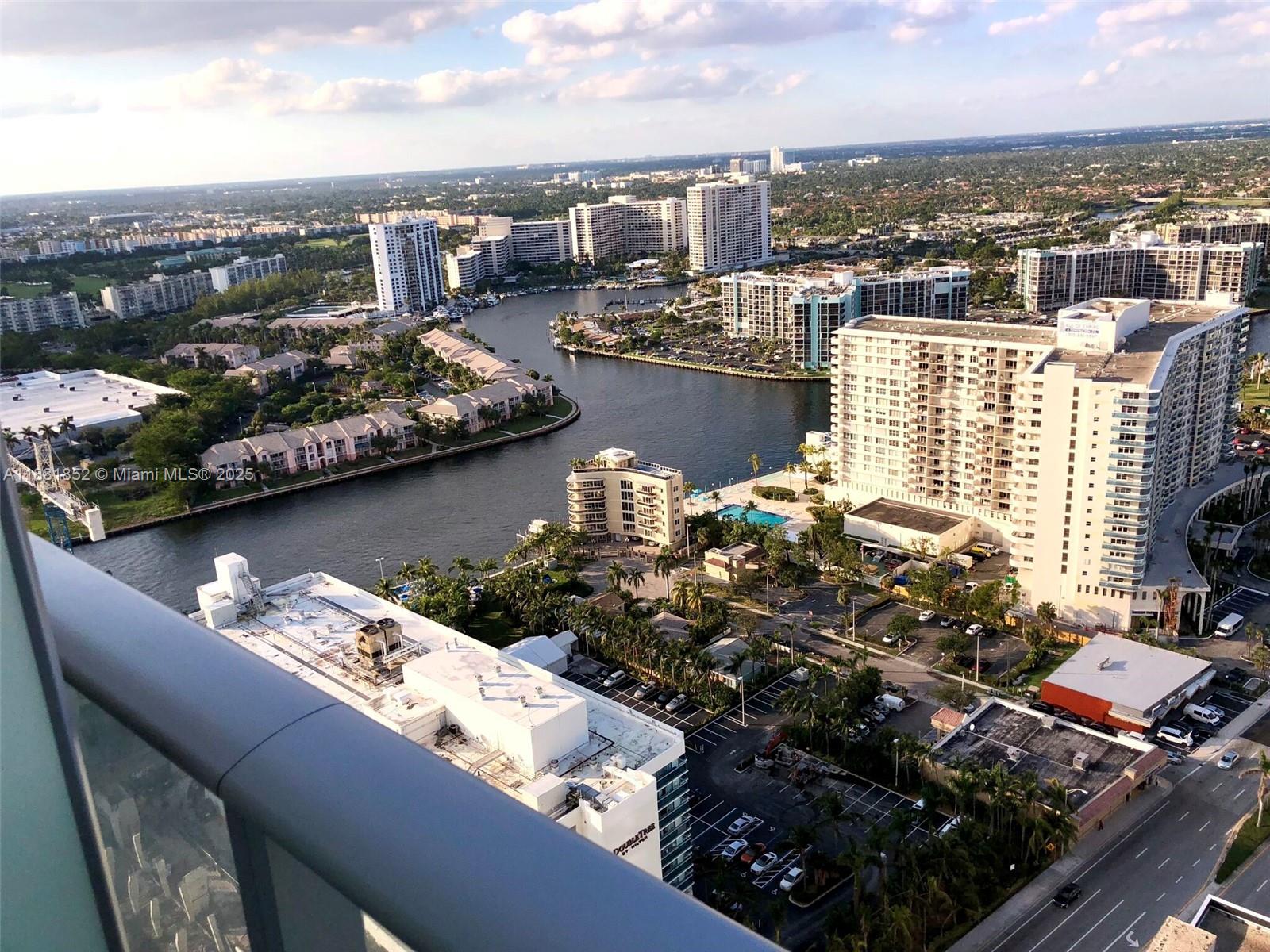 An elevated view shows a waterway winding through a dense urban area with high-rise buildings — 4111 S Ocean Dr # 2910, Hollywood FL 33019, HOLLYWOOD, FL