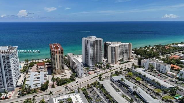 An aerial view shows several high-rise apartment buildings located along a sandy beach and ocean — 3140 S Ocean Dr # 1705, Hallandale Beach FL 33009, HALLANDALE BEACH, FL