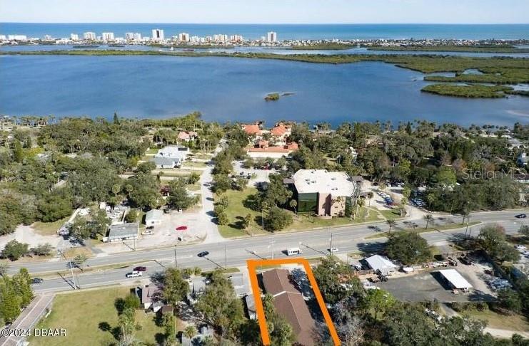 An aerial view shows a building outlined in orange near a road and water — 5110 S RIDGEWOOD AVENUE, PORT ORANGE, FL