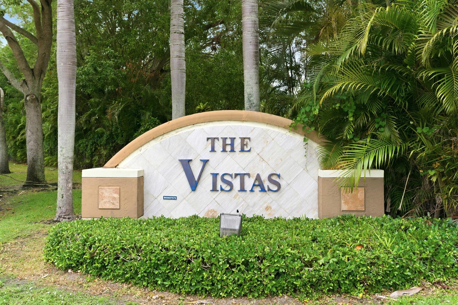 A stone monument sign for The Vistas stands in front of palm trees and landscaping — 10134 Boca Vista Drive, Boca Raton FL 33498, BOCA RATON, FL