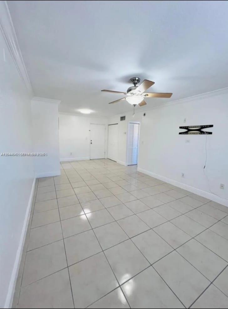 An empty room with white walls, light-colored tile flooring, and a ceiling fan — 606 W 81st St # 224, Hialeah FL 33014, HIALEAH, FL