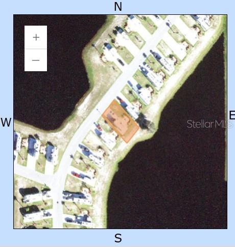 This aerial map shows a residential property highlighted in orange along a curved road — 124 RHETT BOULEVARD E, LAKE WALES, FL